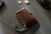 brown leather wallet on desk with sunlight - OCHRE handcrafted