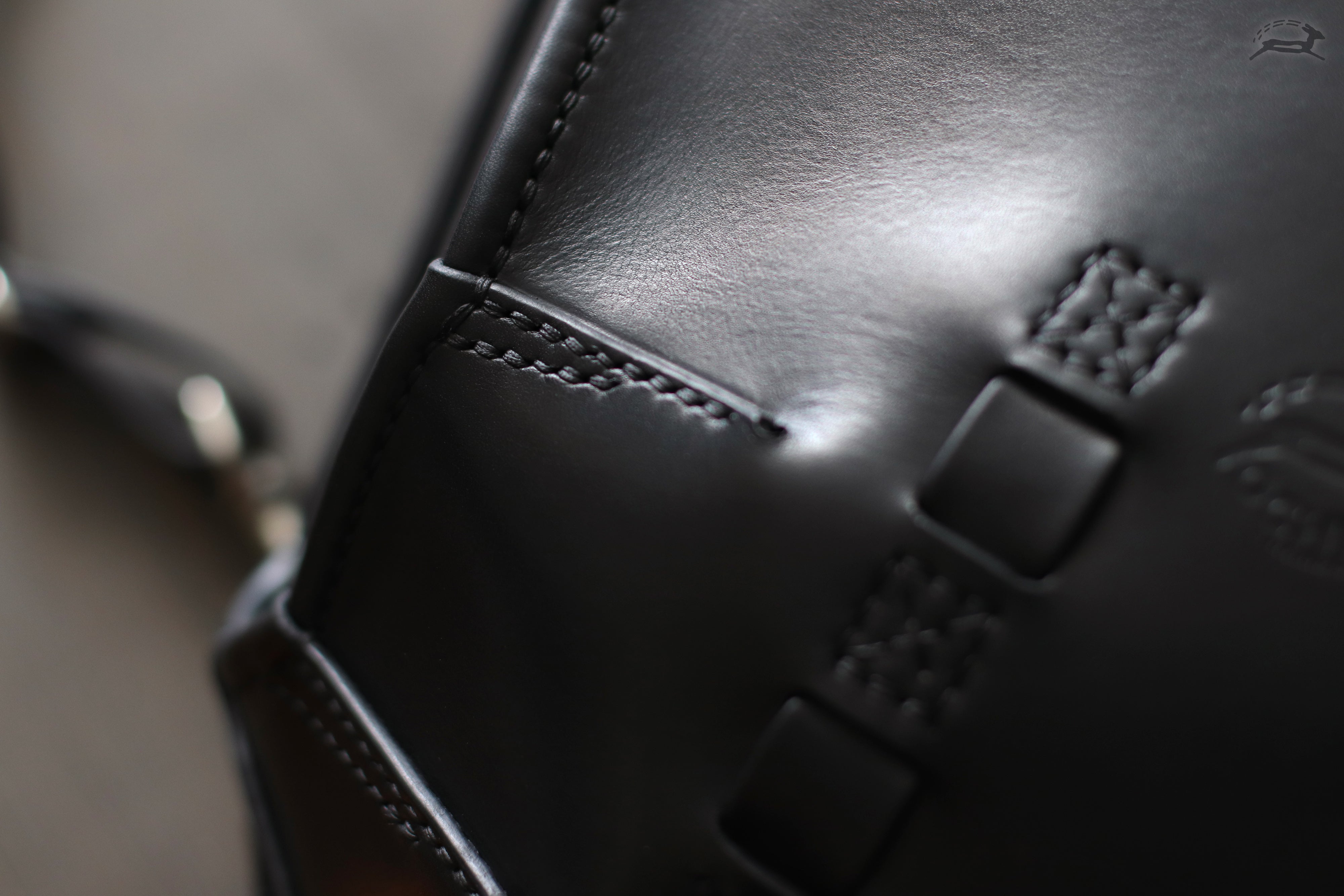 handcrafted leather bag stitch detail
